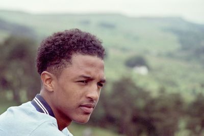 Portrait of young man looking away