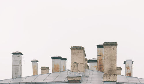 Low angle view of roof with pipes