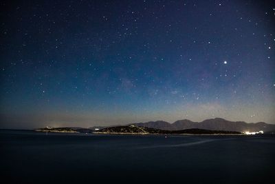 Scenic view of sea against sky at night