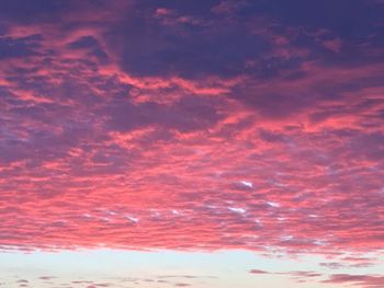 Low angle view of cloudy sky at sunset