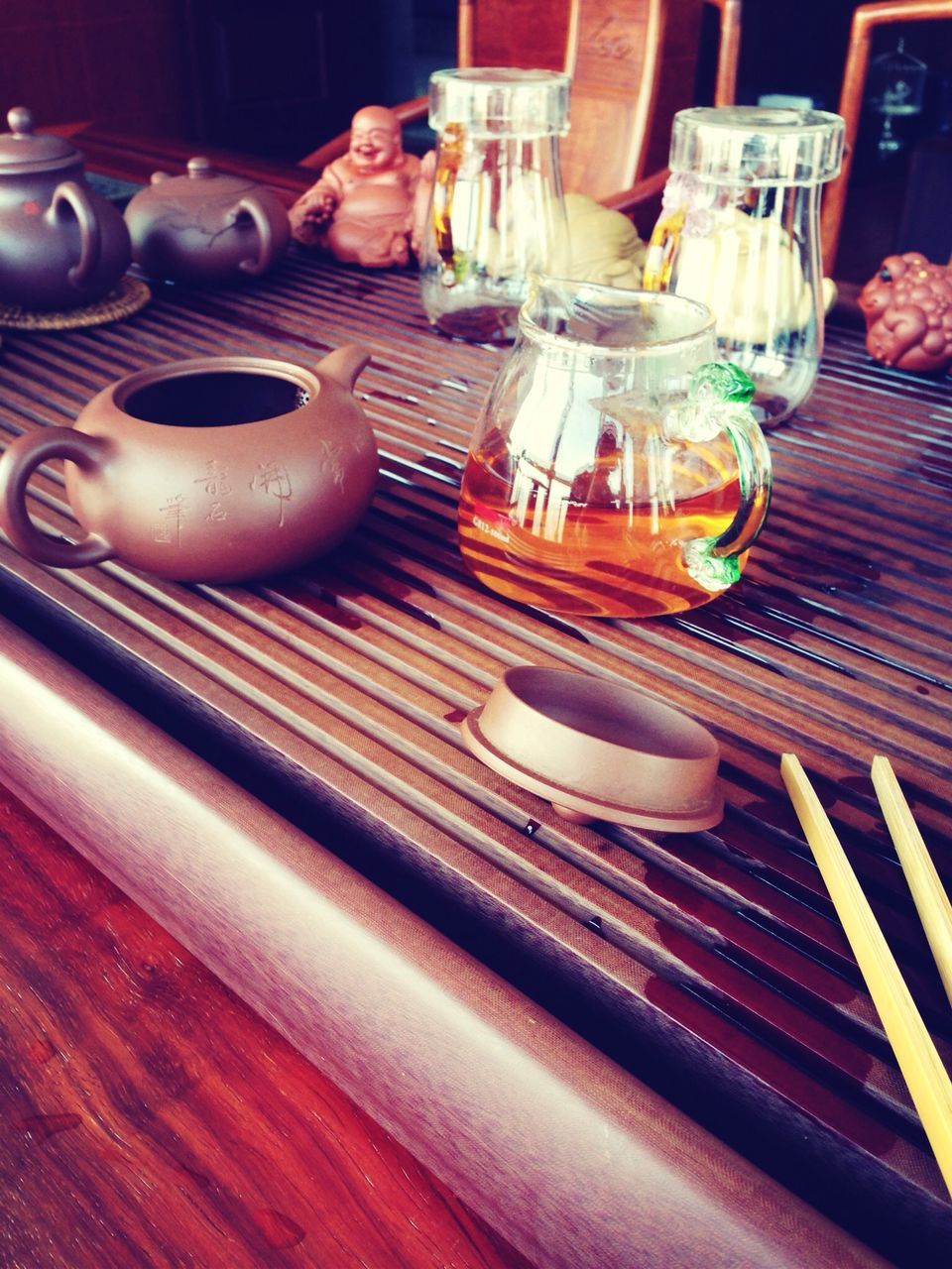 indoors, table, still life, wood - material, high angle view, close-up, variation, no people, arrangement, choice, art and craft, home interior, selective focus, in a row, large group of objects, shelf, multi colored, bottle, restaurant, food and drink