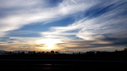 Silhouette of cityscape at sunset