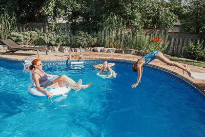 Man jumping in swimming pool