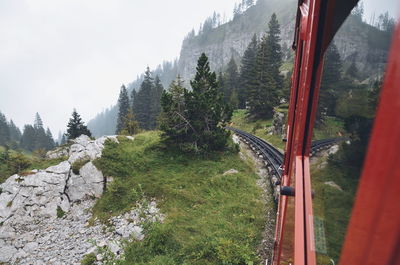 Personal perspective of train passing through scenic landscape