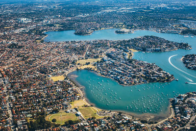 Aerial view of sea and buildings in city