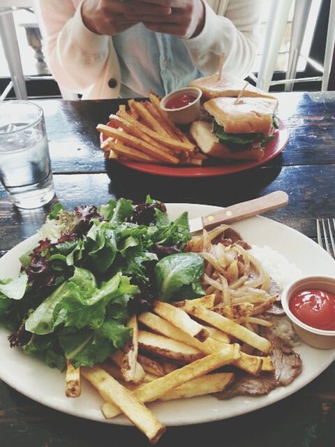 food and drink, food, freshness, ready-to-eat, healthy eating, indoors, plate, table, vegetable, meal, meat, serving size, person, indulgence, still life, close-up, restaurant, french fries