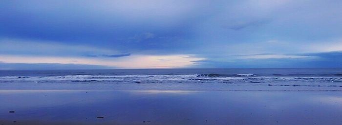 Scenic view of sea against dramatic sky