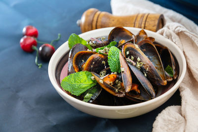 High angle view of mussels in bowl on table