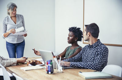 Multi-ethnic business people discussing in board room