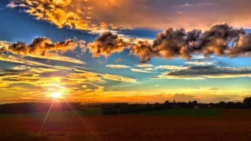 Scenic view of landscape at sunset