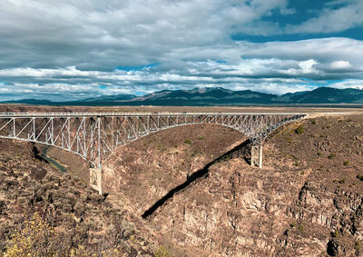 Rio grande gorge bridge taos new mexico dramatic winter sky desert