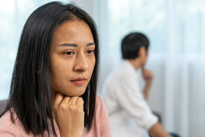 Portrait of a young woman looking away