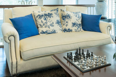 Empty chairs and table on bed at home