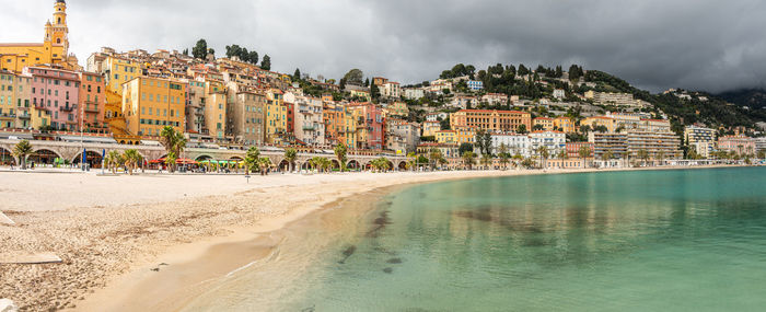 High angle viewof the beautiful beach of menton with turquoise water and beautiful colorful houses 