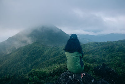 Rear view of man looking at mountains