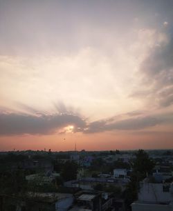 High angle shot of townscape against sky at sunset