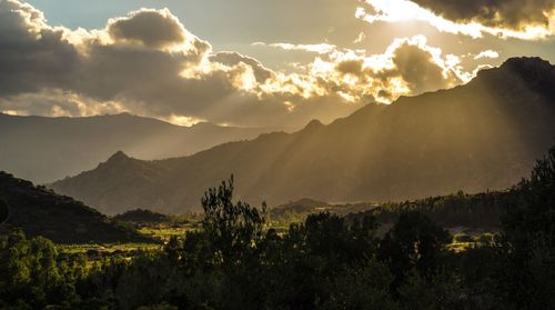 Scenic view of mountains against sky at sunset