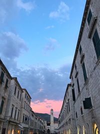 Low angle view of buildings in city against sky