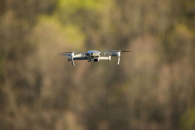 Quadcopter with a camera in flight. technique for aerial photography