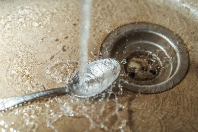 High angle view of drinking water in container at home