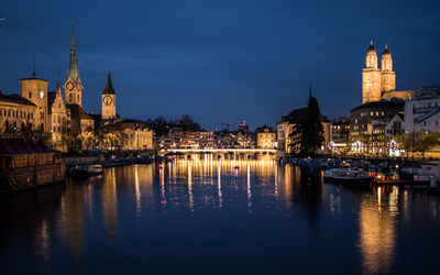 Illuminated buildings at waterfront