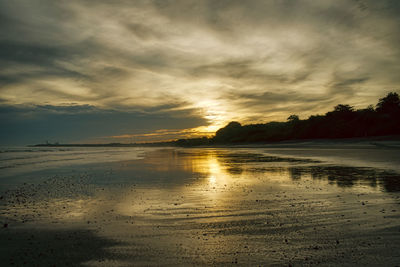 Scenic view of beach against sky during sunset, panama