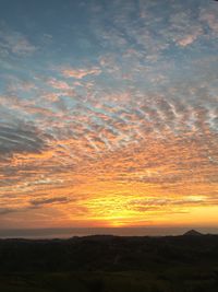 Scenic view of dramatic sky during sunset