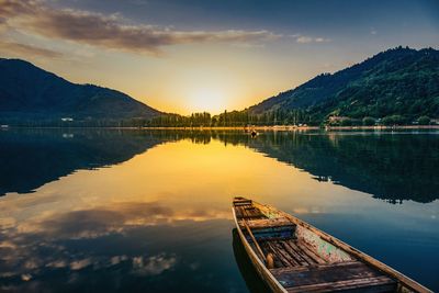 Scenic view of lake against sky during sunset