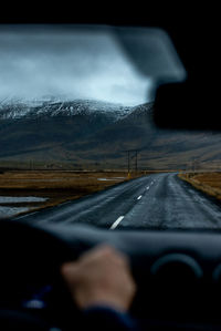 Road seen through car windshield