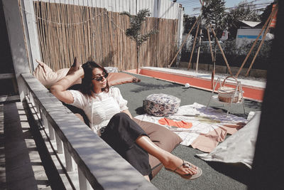 High angle view of woman sitting on floor