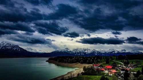 Panoramic view of town against cloudy sky