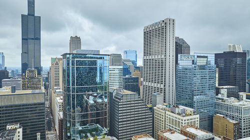 Modern buildings in city against sky