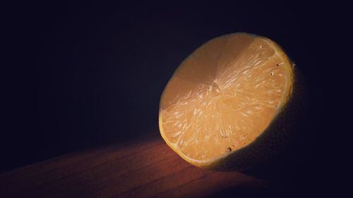 Close-up of orange slice on table