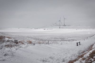 Scenic view of snow field against sky