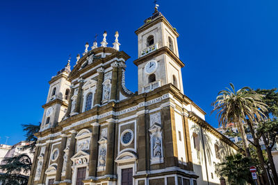 Low angle view of building against clear blue sky