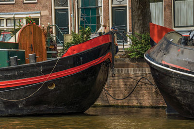 Big boats moored on canal in amsterdam. the netherland capital full of canals.