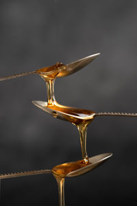 Close-up of wineglass on table against white background