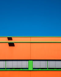 Low angle view of building against clear blue sky