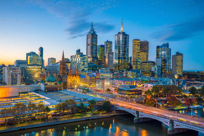 High angle view of illuminated buildings in city against sky