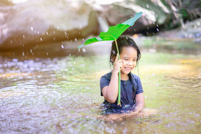 Cute girl enjoying in water