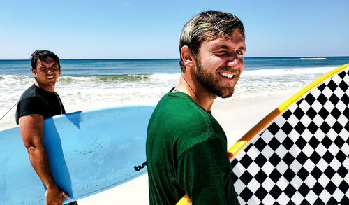 Portrait of smiling young man on beach