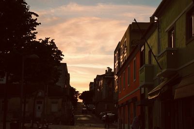 City against sky at sunset