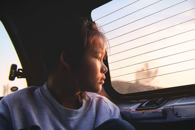 Girl traveling in car