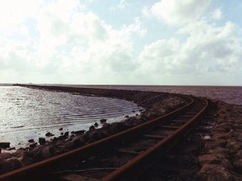 Railroad track against sky