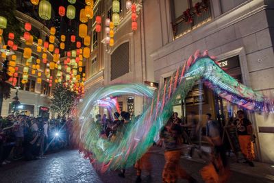 Crowd on illuminated city at night