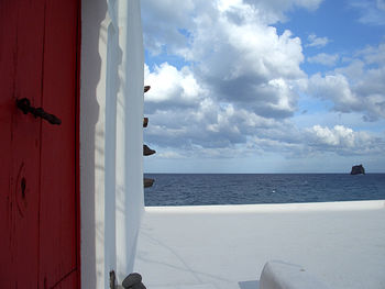 Scenic view of sea against cloudy sky