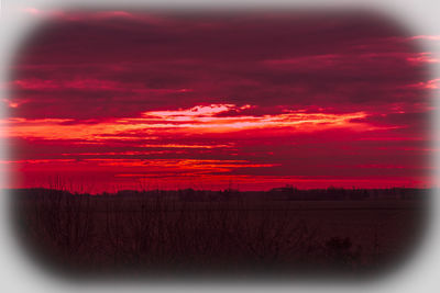 Scenic view of sunset over land