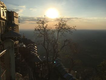 View of city against sky at sunset