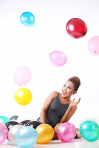 Portrait of woman with balloons