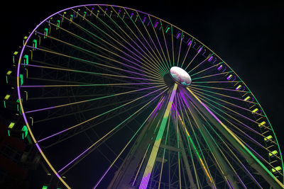 Germany, bavaria, wurzburg, multiple exposure of spinning ferris wheel at night